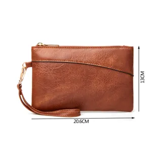 Stylish brown leather clutch bag with wrist strap, compact size 20.6x13cm for daily use.