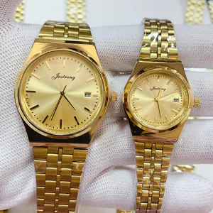 Gold stainless steel quartz couples watch set with convenient calendar display close up view
