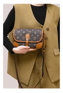 Classic stylish women's leather baguette shoulder bag, retro monogram crossbody design daily.