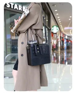 Black crocodile pattern crossbody leather bag with convenient built-in cup holder for outdoor.