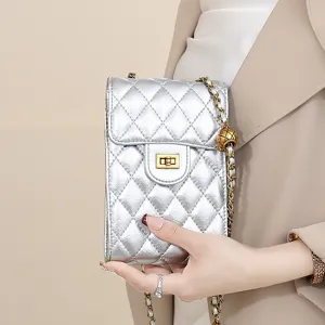 Silver quilted phone bag detail, classic diamond pattern with luxury metal chain and twist lock.