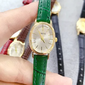 Minimalist oval quartz women watch with green leather strap and gold case elegant timepiece