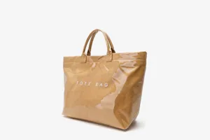 Detail view of the waterproof khaki DuPont paper tote bag, featuring sturdy dual handles and texture.