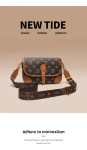 Detailed view of brown monogram crossbody bag strap and metal buckle hardware craftsmanship.