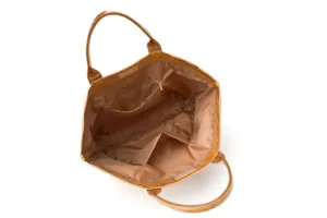 Interior detail view of brown tote bag with inner zipper pocket and large capacity storage.