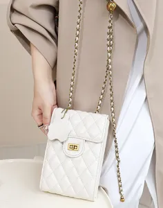 Quilted leather mini phone bag with chain strap and elegant chic design for daily use.