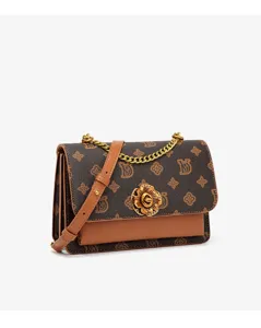 Detailed view of luxury monogram shoulder bag, featuring gold chain strap and camellia lock.