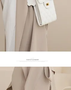 White quilted leather mini crossbody phone bag with gold hardware, elegant chain shoulder strap.