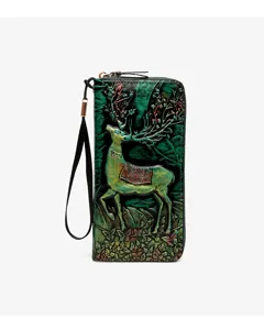 Vintage embossed deer long wallet detail, intricate forest tooling pattern on green leather.