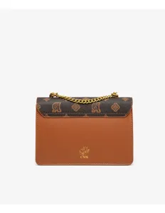 Detail shot of women's brown leather shoulder bag with chic patterned flap and chain strap.