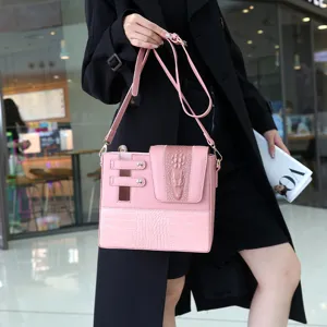 Pink leather shoulder bag for women with stylish crocodile pattern embossing and chic hardware.