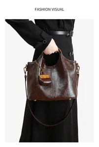 Detailed view of the dark brown genuine leather handbag showcasing its exquisite texture and charm.