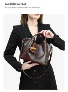 Genuine leather bucket tote handbag with lock charm, stylish casual shoulder crossbody bag.
