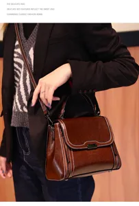 Vintage genuine leather crossbody bag for women, stylish brown shoulder bag with top handle.