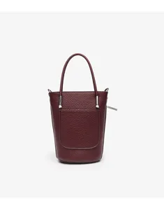 Miniature leather bucket bag with top handle and front pocket detail in elegant burgundy finish.