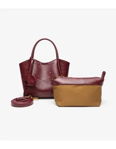 Detail view of the elegant red women bucket handbag set with matching pouch and strap.