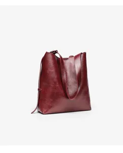 Burgundy leather tote bag for women, simple solid color shoulder bag for daily commuting use.