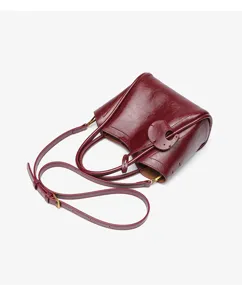 Burgundy women handbag niche design bucket shoulder bag stylish commuting crossbody bag for daily use.