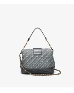 Detailed view of woven shell bag, premium textured pattern featuring classic gold chain strap.