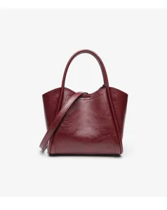 Red leather bucket bag for women, chic crossbody handbag and stylish daily commuter tote.