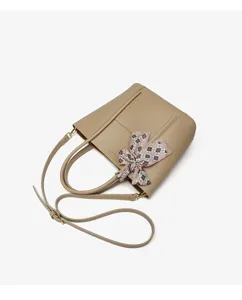 Elegant beige leather tote bag with stylish plaid ribbon accent, perfect for daily wear.
