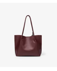 Spacious faux leather commuting tote bag for women, stylish minimalist shoulder bag for daily use.