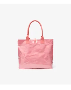 Pink Tyvek tote bag detail view, showing crinkled texture, sturdy handle, and capacity.