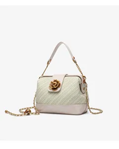Exquisite camellia woven shell bag detail featuring elegant gold chain and metal flower lock.