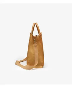 Side profile view of a vintage washable kraft paper tote bag with top handles and strap.