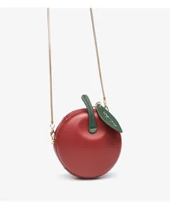 Red apple shaped crossbody bag with metal chain strap and cute green leaf tag for women.