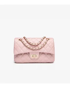 Pink quilted leather crossbody bag detail showcasing metal chain strap and turn-lock closure.