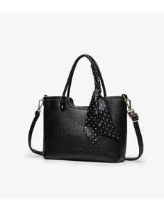 Black leather tote handbag for women, casual commuter shoulder bag with polka dot scarf.