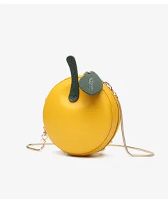 Yellow apple shaped round crossbody shoulder bag with chain strap and luxury logo tag.