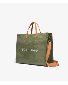 Detailed view of the olive green vintage kraft paper tote bag with brown handles and strap.