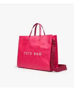 Pink crinkled texture large capacity tote bag featuring dual handles and long shoulder strap.