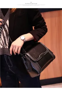 Detailed shot of a stylish black leather crossbody bag worn by a model, premium daily look.