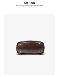 Detailed view of genuine leather bucket bag bottom with metal feet, minimalist design style.