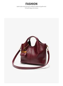 Burgundy leather tote and shoulder bag for women, stylish bucket bag with cute charm.