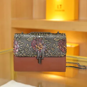 Chinese style retro embossed women shoulder bag with exquisite floral flap and metal lock.