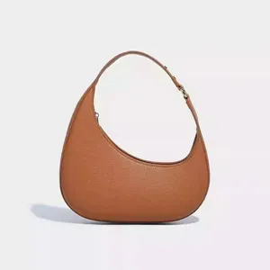 Brown crescent hobo shoulder bag with textured leather detail and metal buckle hardware.