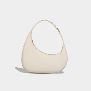 Detailed view of the elegant minimalist crescent hobo shoulder bag with fine leather texture.