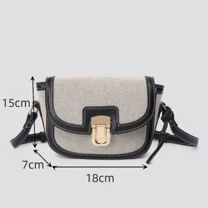 Color-blocked canvas saddle bag with metal lock, versatile retro crossbody bag.