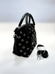 Black rhinestone handbag detail, stylish top handle and shoulder bag presentation.