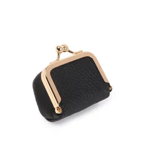 Detailed view of the black leather mini kiss lock coin purse with gold frame and clasp.
