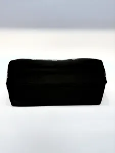 Close-up detail of the black evening handbag featuring sparkling rhinestone trim and smooth fabric.