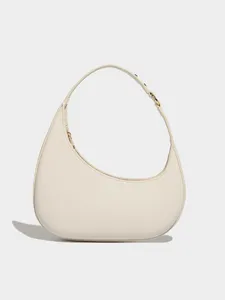 Stylish minimalist crescent shoulder bag, chic cream white hobo handbag for daily fashion.