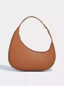 Brown leather crescent shoulder bag for women, stylish minimalist hobo handbag for summer.