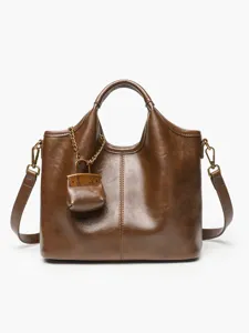 Brown leather tote bag with stylish shoulder strap and mini charm for women casual daily wear