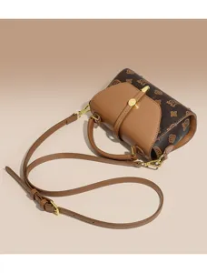 Vintage monogram crossbody bag for women, stylish brown shoulder bag with top handle.