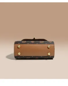 Vintage monogram handbag bottom detail showing metal protective feet and brown PU leather.